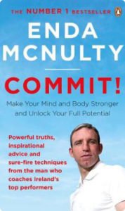 Cover of the book 'Commit!' by Enda McNulty with the subtitle 'Make Your Mind and Body Stronger and Unlock Your Full Potential,' featuring the author against a blue sky background.